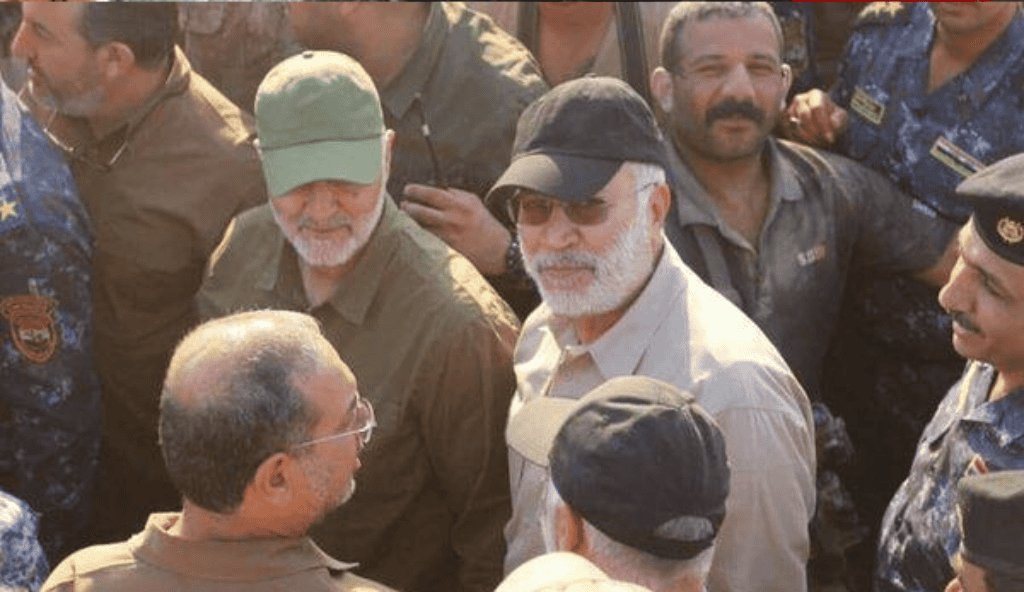 Qods Forces Commander Qassem Soleimani (green hat) and Popular Mobilization Forces operational commander Abu Mahdi al Muhandis (black hat). 