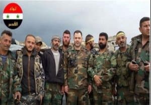 The leader of the Quds Brigade Mohammad Ahmad, middle, with combatants. 